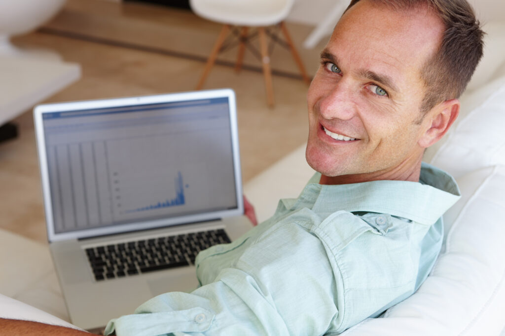 its amazing how much you can accomplish from home shot attractive mature man smiling camera while working report