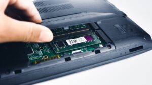 technician inspects ram laptop computer by opening lid random access memory 41472 888