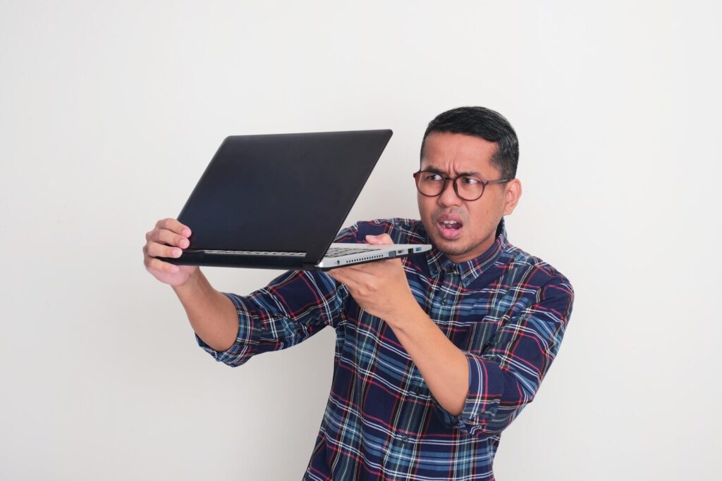 man slowly peeking his laptop screen with worried expression 524151 4204 man slowly peeking his laptop screen with worried expression 524151 4204