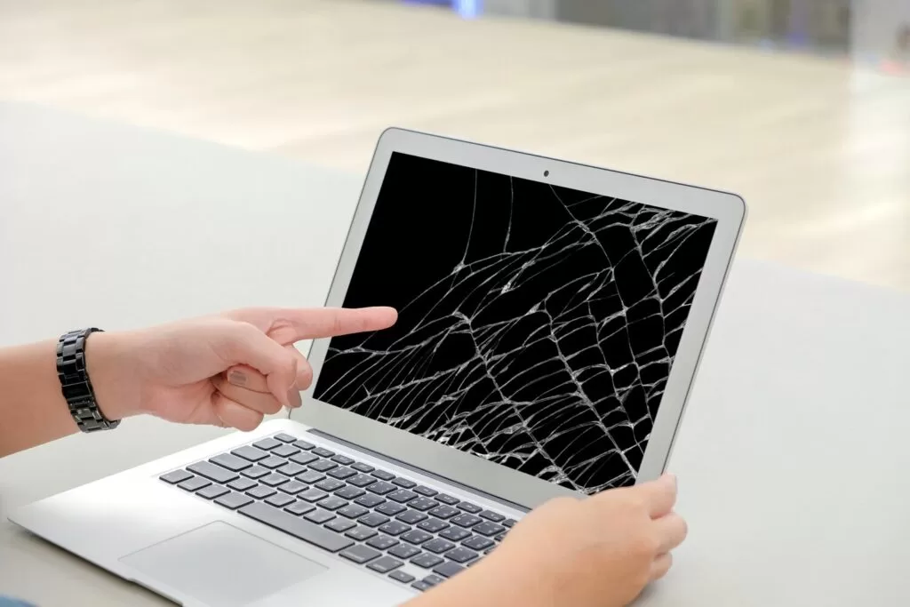 hands pointing cracked laptop screen 33997 176