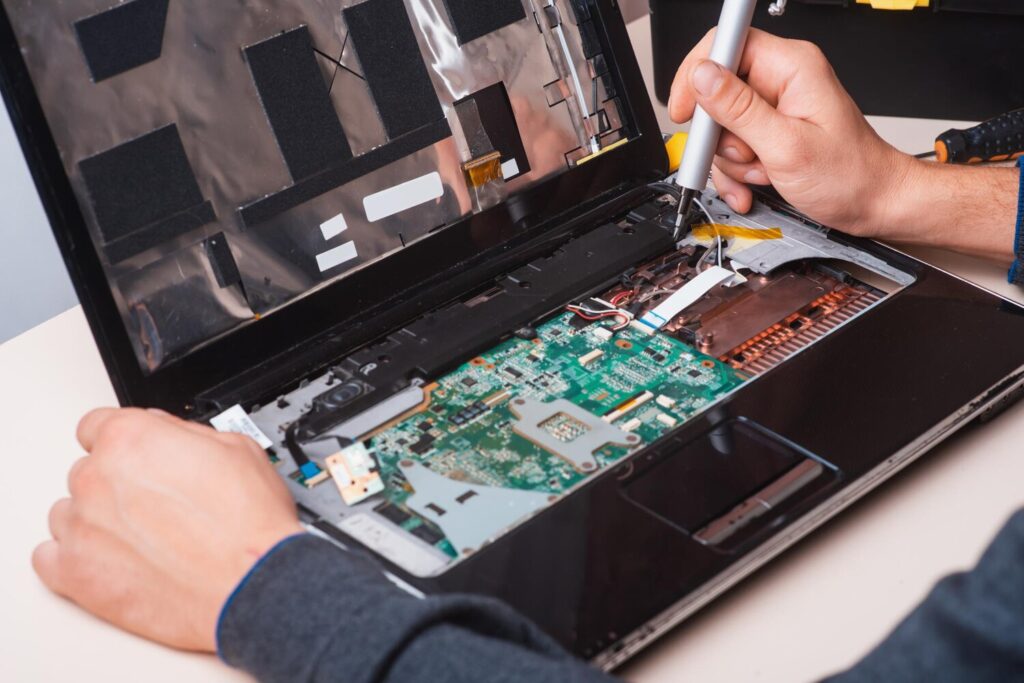 wizard repairs laptop with tools hands 205121 776